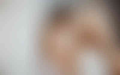 bride putting on her wedding dress