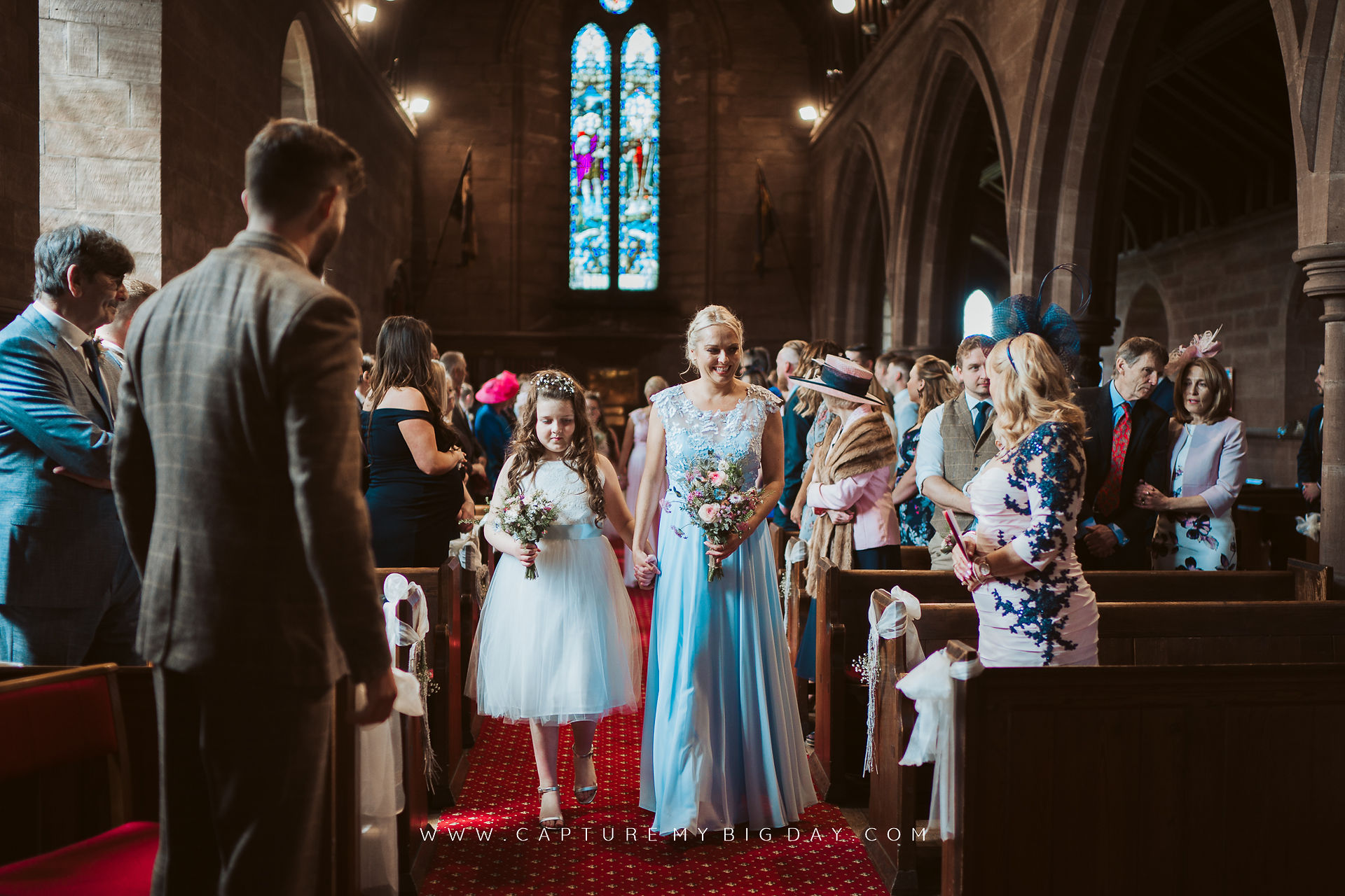 bridesmaid walking down the aisle
