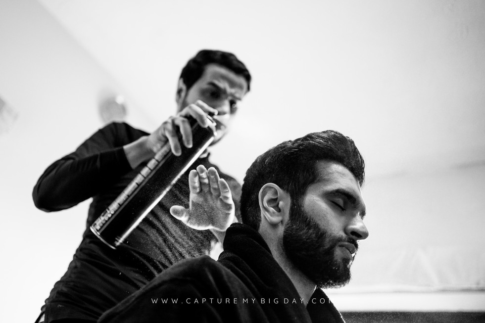 Groom having his hair done