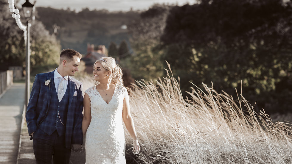 Bride and groom walking outside Tower Hill Barn