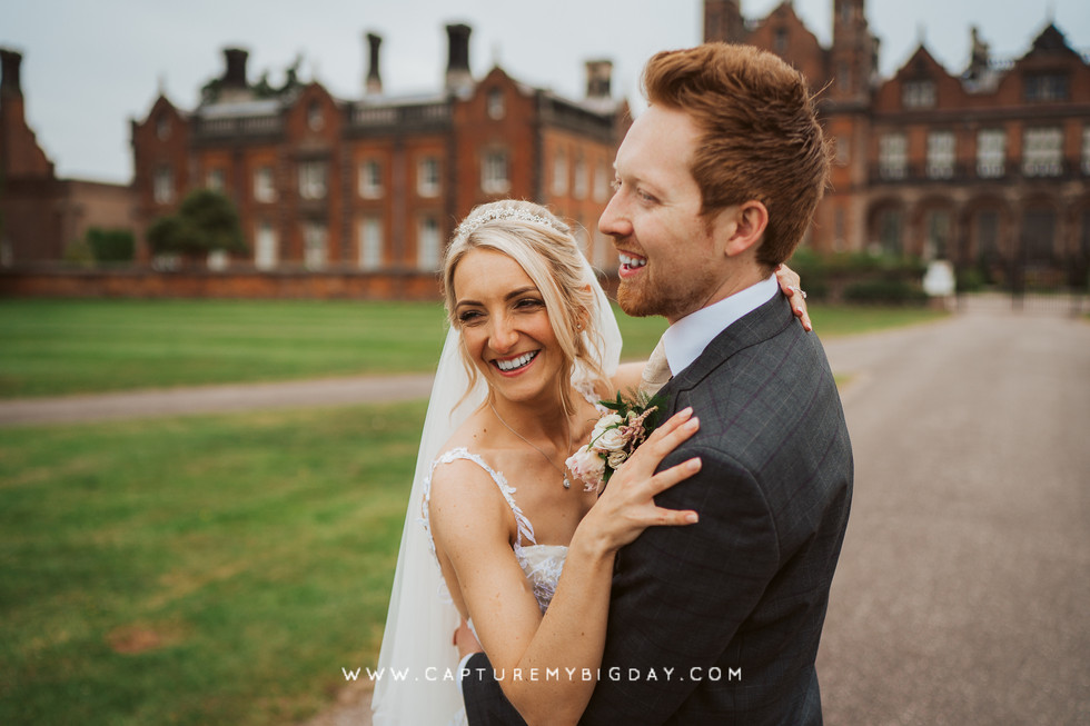 bride and groom hugging