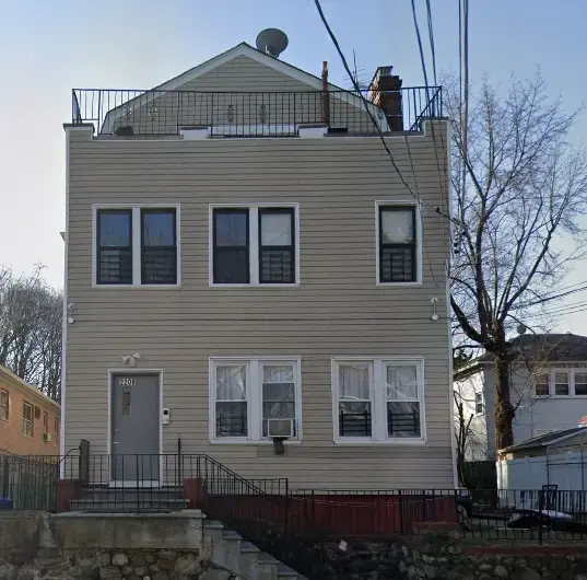 Tan two-story house for sale