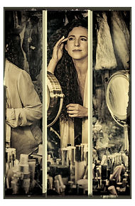 woman carefully applies makeup in mirror