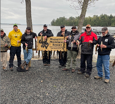 men showing fish caught on a fishing trip on lake kabetogama moosehorn resort