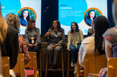 A panel of professional women at a small networking breakfast event in London.