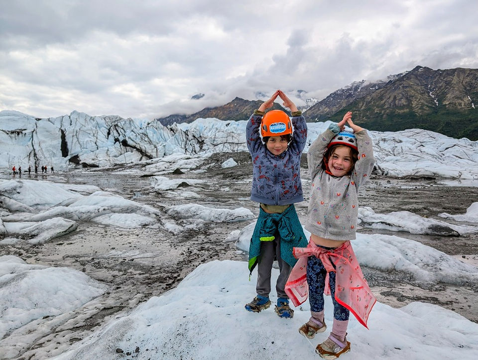 Our younger children wearing helmets and crampons, standing on the Matanuska Glacier in Alaska