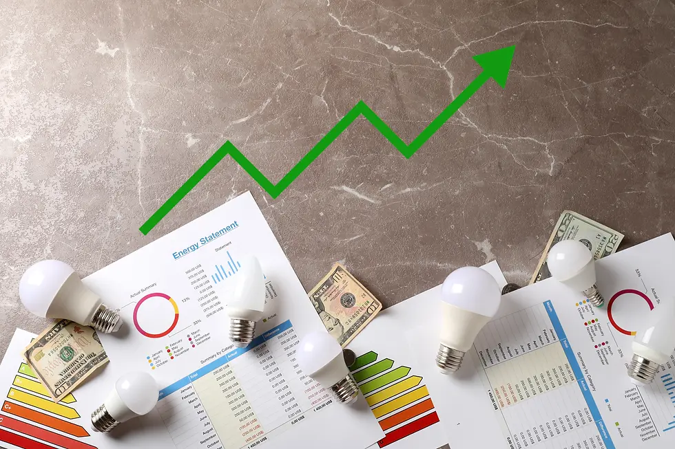 Energy-saving concept: Light bulbs and money on energy charts. Green upward arrow on gray background signifies efficiency and cost-saving.