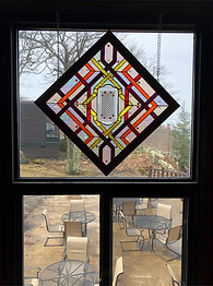 Stained glass window entitled "Looking Back In Time"