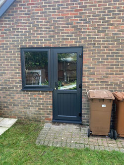Grey PVCu door with shiplap panelling