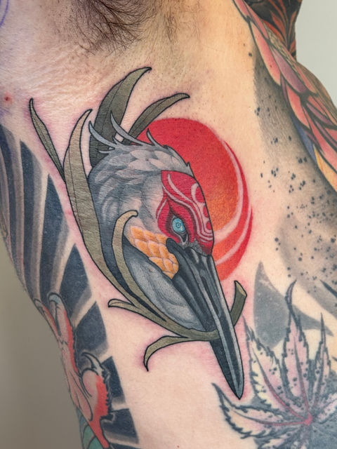 Colorful bird tattoo