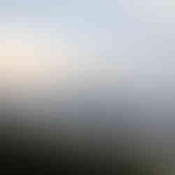 View from Jagmandir of Lake Pichola and the Aravalli Mountains in the background, making it one of the attractions you should visit in Udaipur, India