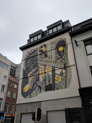 Street art murals on the side of a building 
