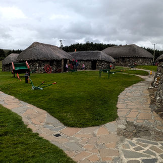 Small stone houses with thatched rooves making the Skye Museum of Island Life one of the best things to see and do in Skye