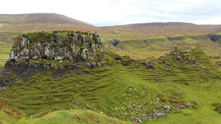 Green landscape with rolling hills which is a perfect place to find the enchanted fairies of Scotland
