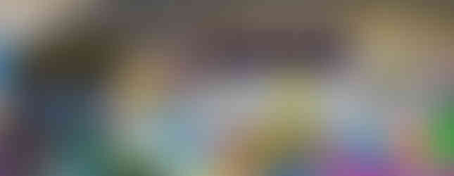 One of the Aberdeen street art murals under a granite archway.