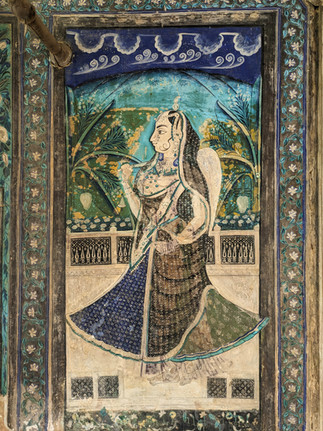 Frescoes painted on the walls of a palace, depicting many scenes, making it one of the attractions you should visit in Bundi, India