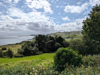 View from the Flodigarry Hotel looking over the sea with the mountains in the background making Flodigarry one of the best things to see and do in Skye