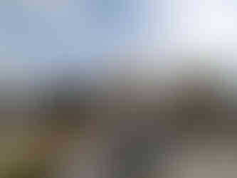 View from the outdoor rooftop terrace of the Hotel Boheda Palace, looking over the city of Udaipur, making it one of the attractions you should visit in Udaipur, India