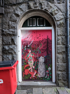 One of the Aberdeen street art murals on a door.