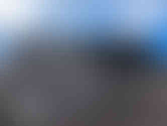 One of the Aberdeen street art murals on a building depicting two people holding each other.