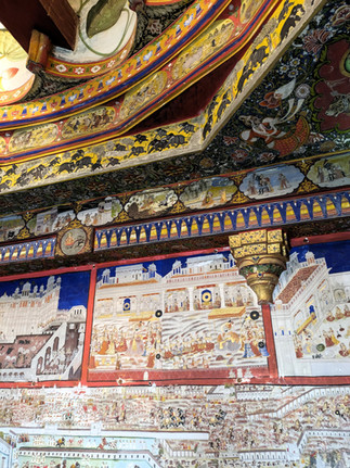 An elaborately painted ceiling in a City Palace room, making it one of the attractions you should visit in Udaipur, India