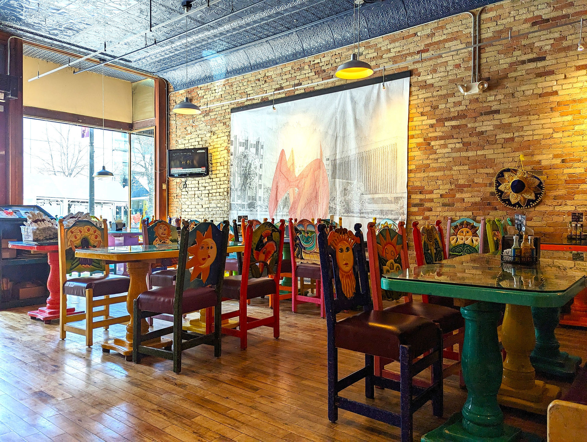 Restaurant in downtown Grand Rapids, with colourful chairs and tables. Tasty food enjoyed during a family day out in Grand Rapids.