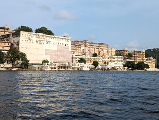 A view from Lake Pichola of the City Palace, making it one of the attractions you should visit in Udaipur, India