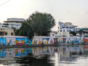 Panels of street art along the banks of Lake Pichola, making it one of the attractions you should visit in Udaipur, India