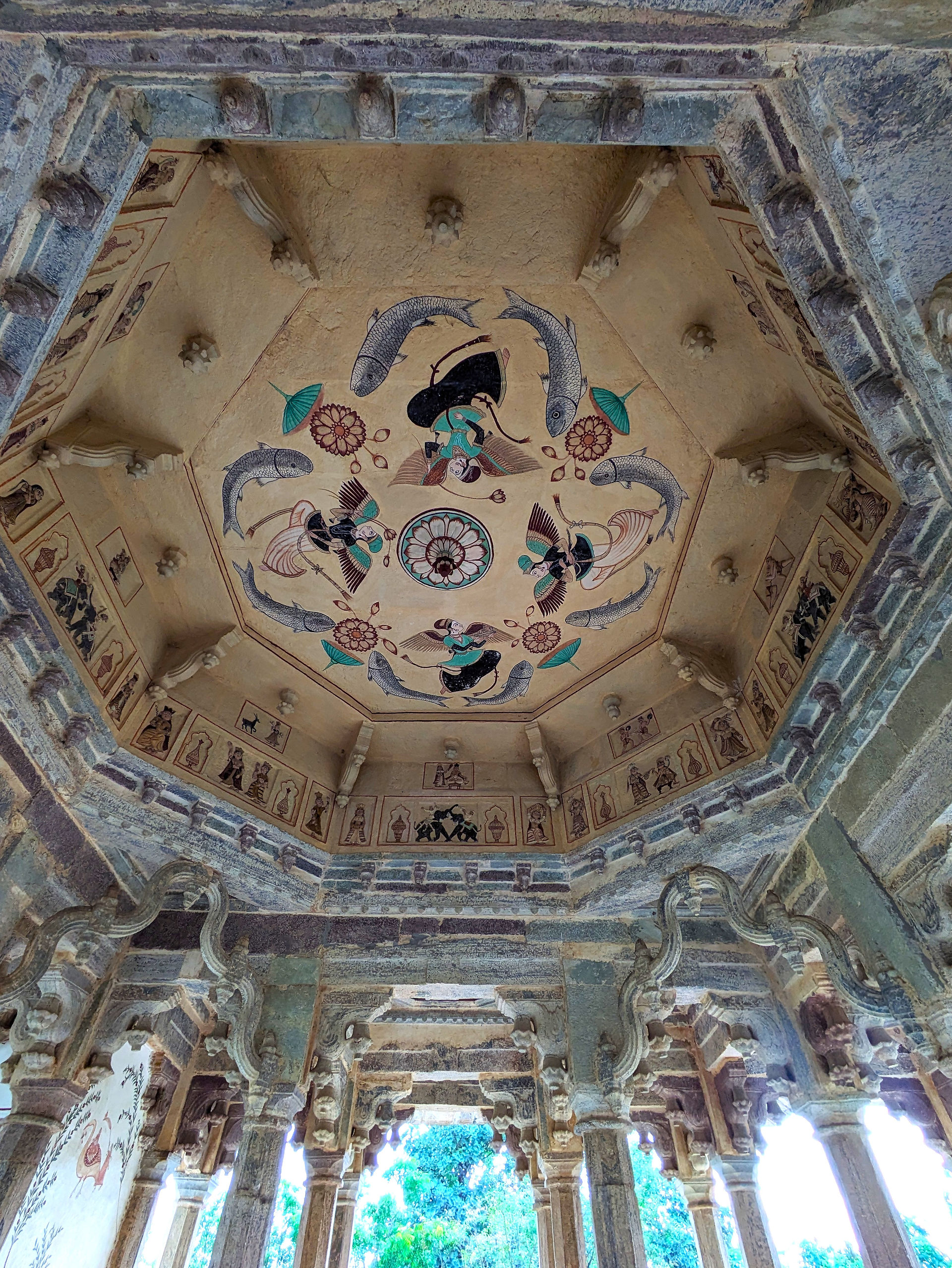 84 Pillered Cenotaph. Inside a stone monument with many columns and a beautifully painted ceiling, making it one of the attractions you should visit in Bundi, India