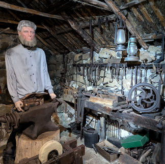 A reconstruction of a man working in a smithy making the Skye Museum of Island Life one of the best things to see and do in Skye
