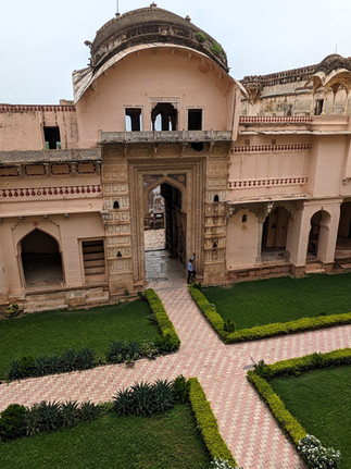 Garh Palace. Courtyard with manicured lawns, making it one of the attractions you should visit in Bundi, India