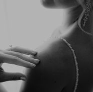 Artistic portrait of a contemplative high-class escort in a sensual, luxurious atmosphere