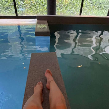 Mademoiselle Marie swimming in the pool at Van der Valk Sélys Liège, luxury companion in Belgium.