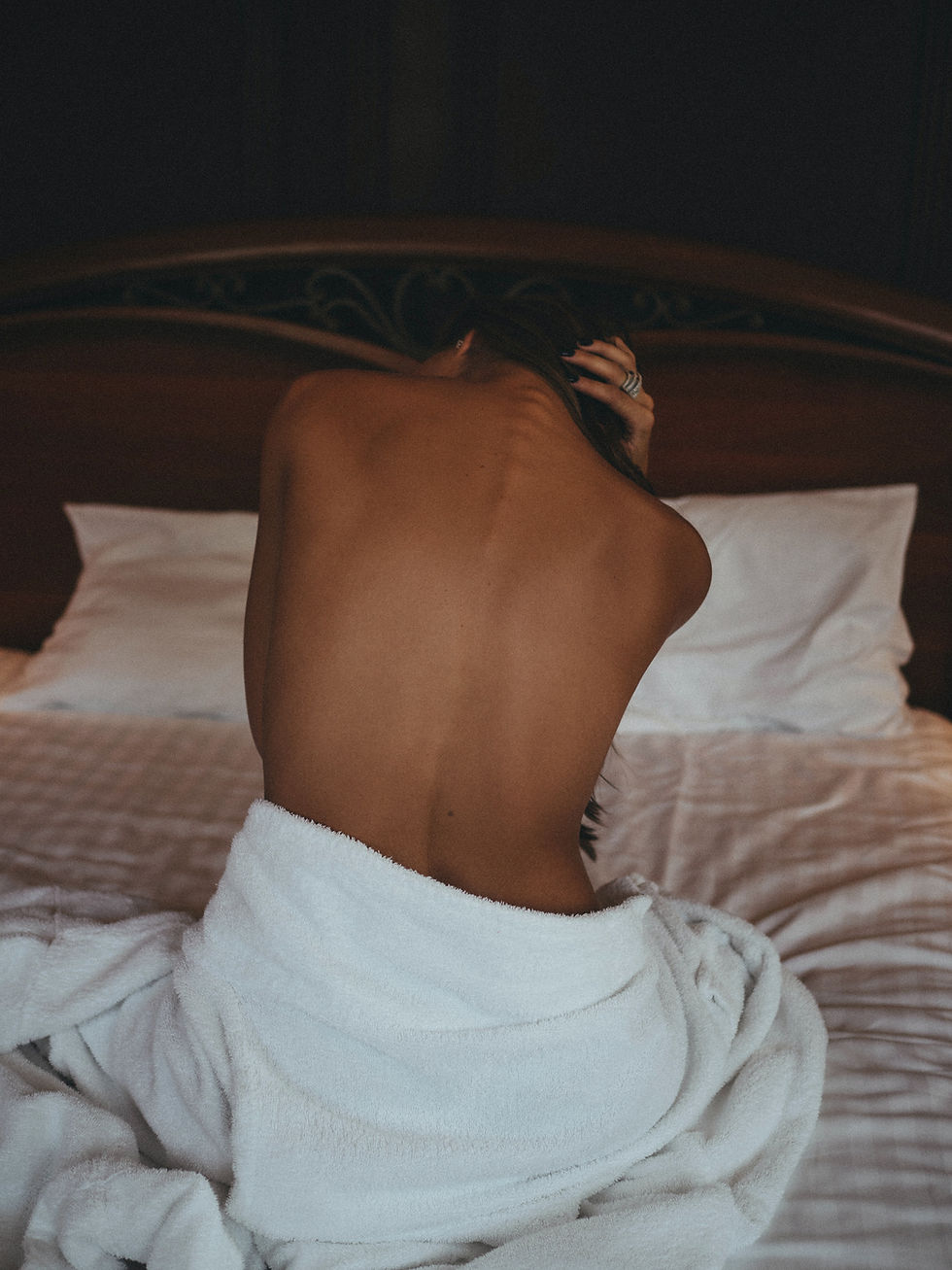 Elegant mature high-end escort in a refined luxury setting, representing confidence, sophistication, and international companionship.