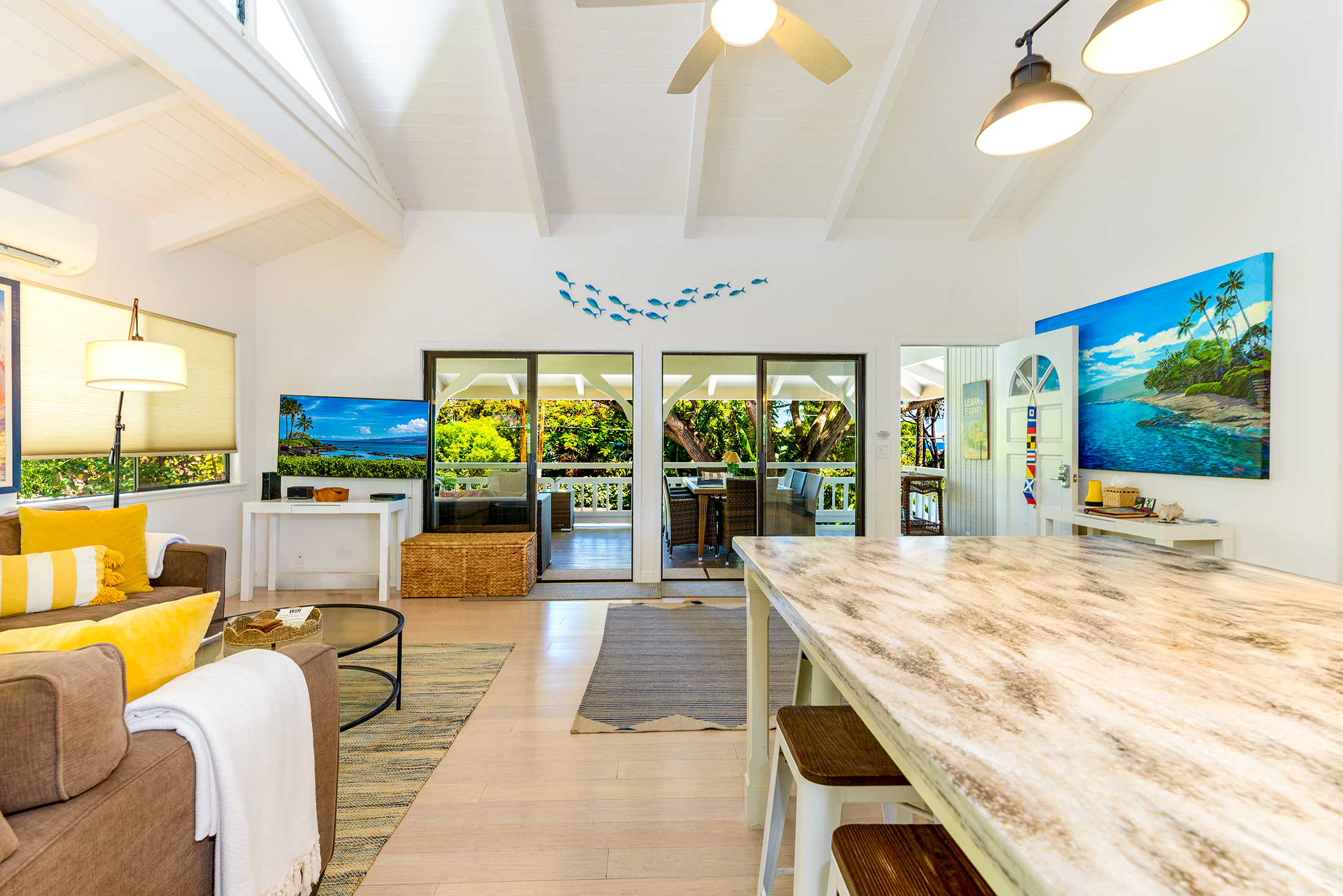 Bright living room at Puako 143 with tropical design