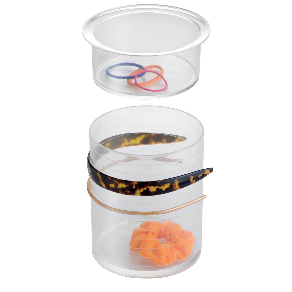Transparante haaraccessoires organizer met los bovenbakje, elastiekjes, één scrunchie en haarbanden op witte achtergrond