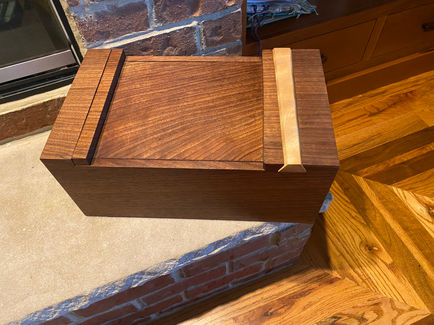 Walnut box with curly beech wedge tenon. Finished in Danish Oil. 
