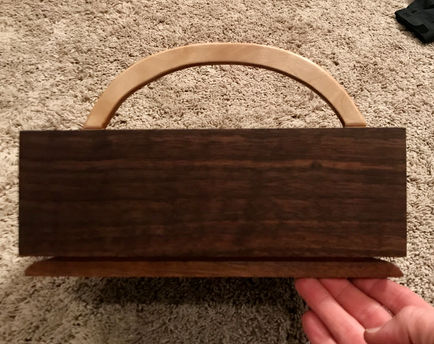 Walnut with dovetail keyed maple handle. Finished in danish oil. 