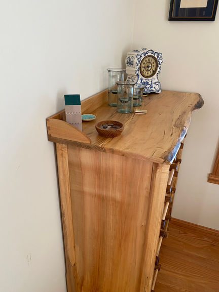 Maple dresser with handcut dovetailed walnut/maple drawers. Lambs tongue detail in the legs and dovetail backsplash. Finished in shellac.