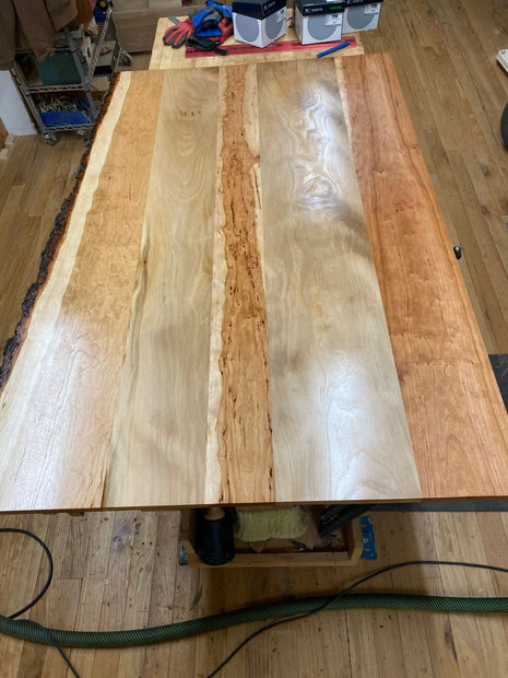Dining table top in sycamore and cherry live edge. Buffed to 2000 grit; finished in Odies Oil. 