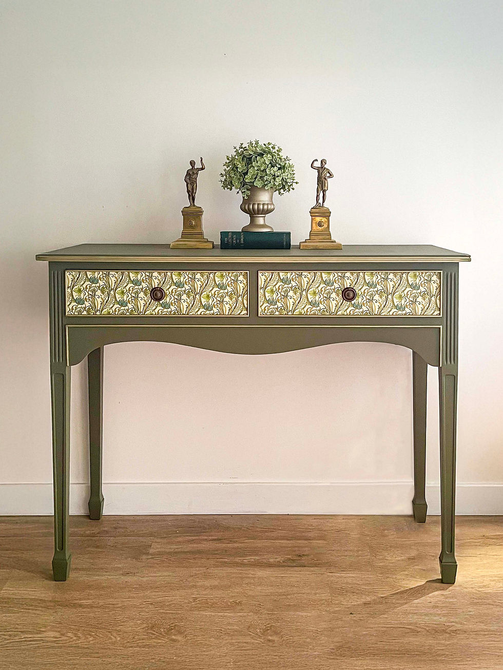 Vintage console table in deep olive green with scroll and vine detail