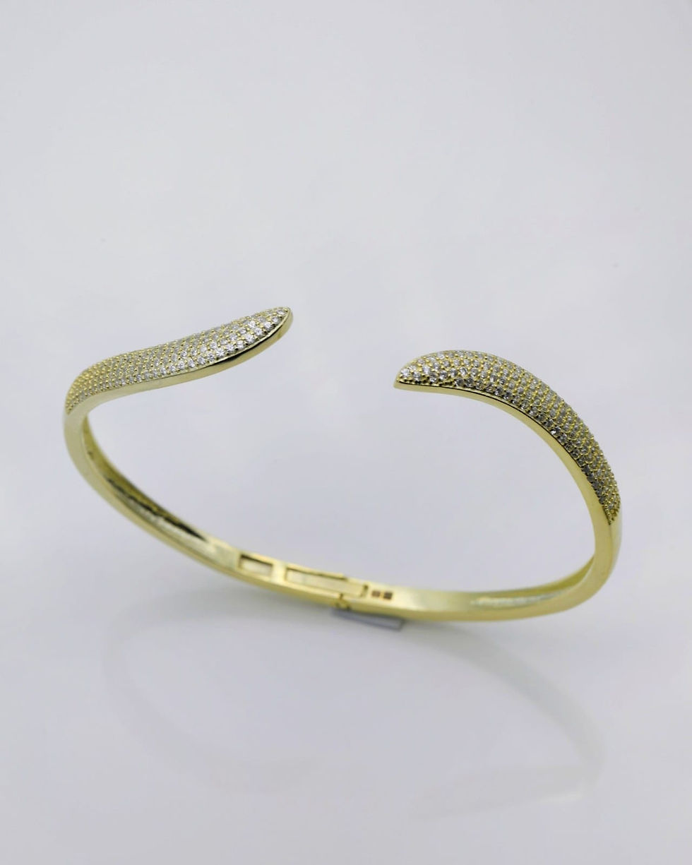 Pulseira  rígida em prata dourada - design ondulado