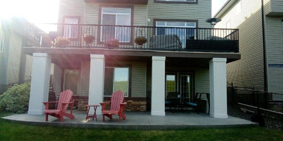 Deck framing stage in Calgary showing joists beams and support layout during construction