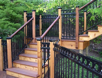 wood deck stairs and black railing