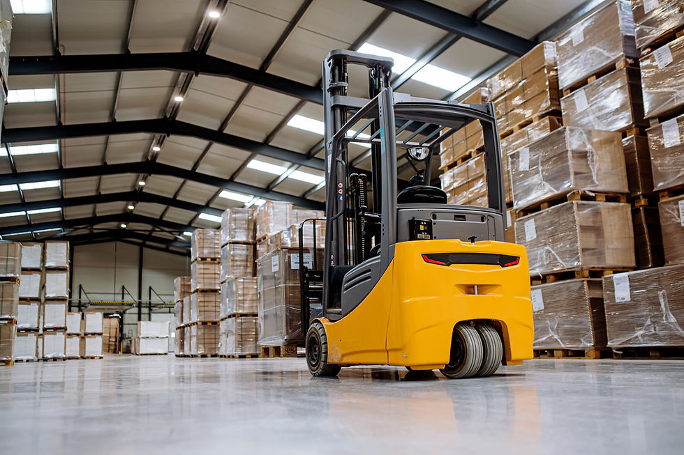 Back view of forklift in warehouse in the middle of stored goods Forklift driver preparing