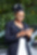 smiley-woman-looking-smartphone-while-leaning-against-her-car.jpg