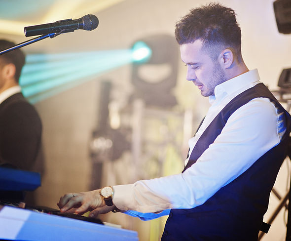musicial-music-live-band-performing-stage-with-different-lights-keyboardist-play.jpg
