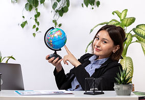 front-view-beautiful-young-businesswoman-black-jacket-blue-shirt-observing-little-globe-sm