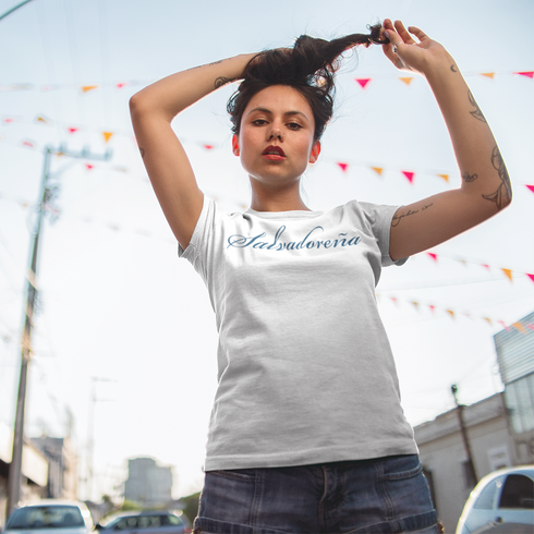hispanic-edgy-woman-wearing-a-sublimated-t-shirt-mockup-while-fixing-her-hair-in-the-stree