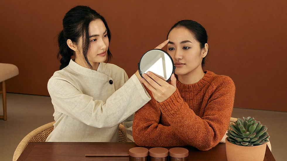 Esthetician and client discussing brow shape options during a consultation in Tucson